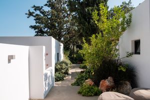 Pathway through lush garden at Minos Beach Art Hotel, Crete.